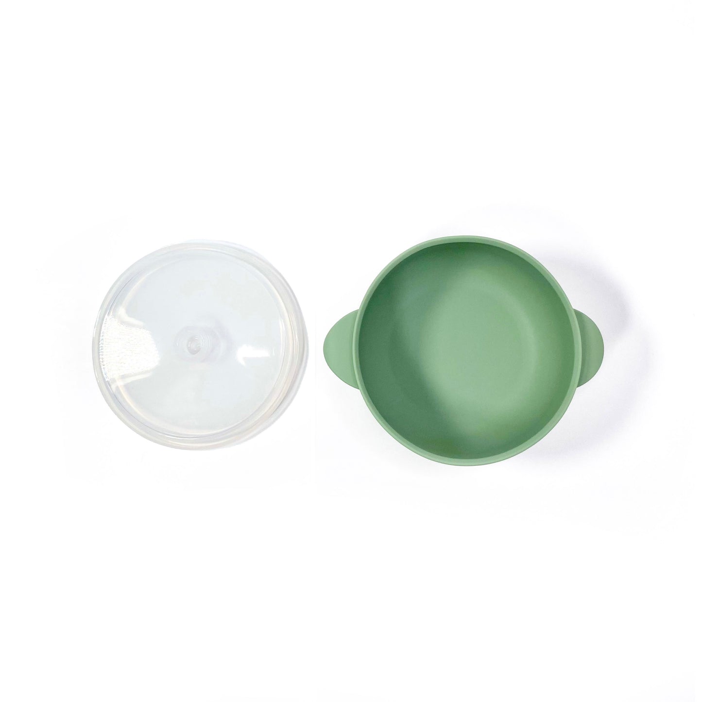 A forest green silicone children’s feeding bowl, with lid and suction cup. Image shows the bowl with lid separately.