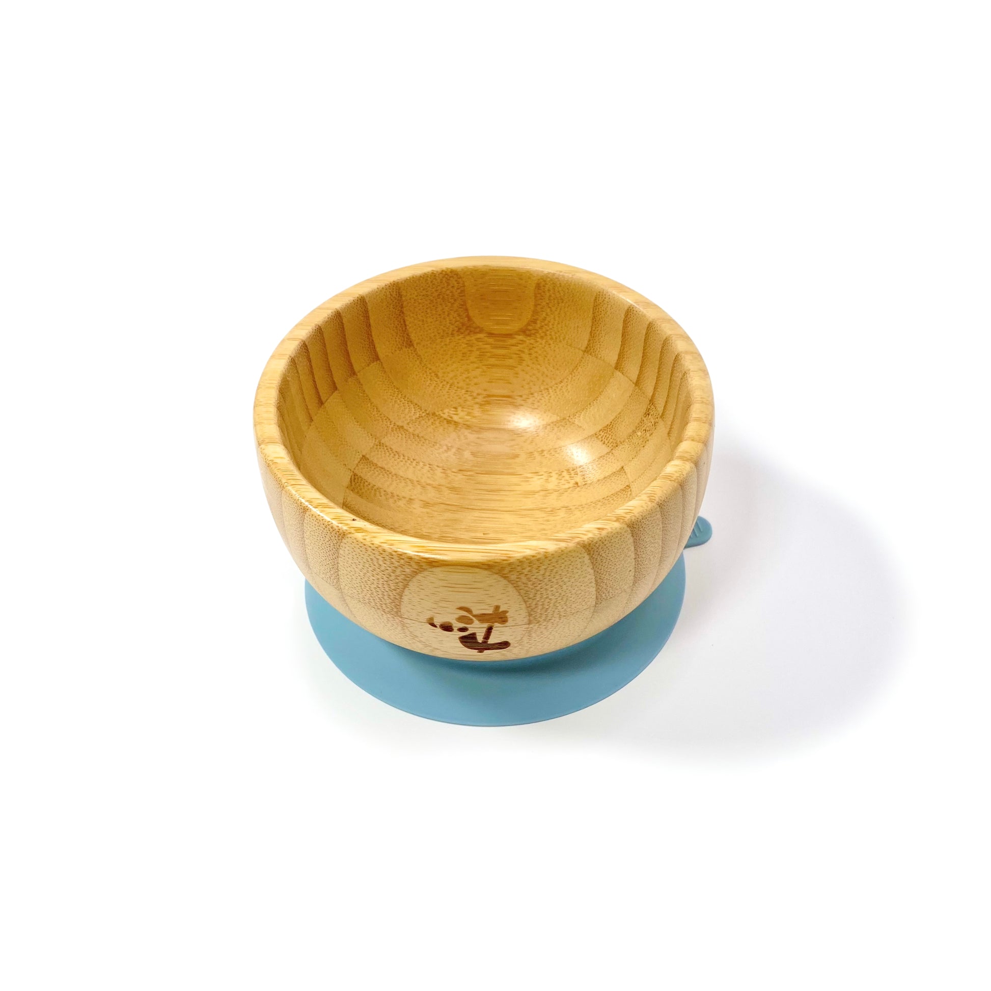A children’s bamboo bowl with a sky blue silicone suction ring.