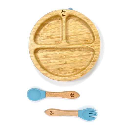 A children’s bamboo tableware set, including bamboo section plate with sky blue silicone suction ring, and matching bamboo and silicone cutlery.