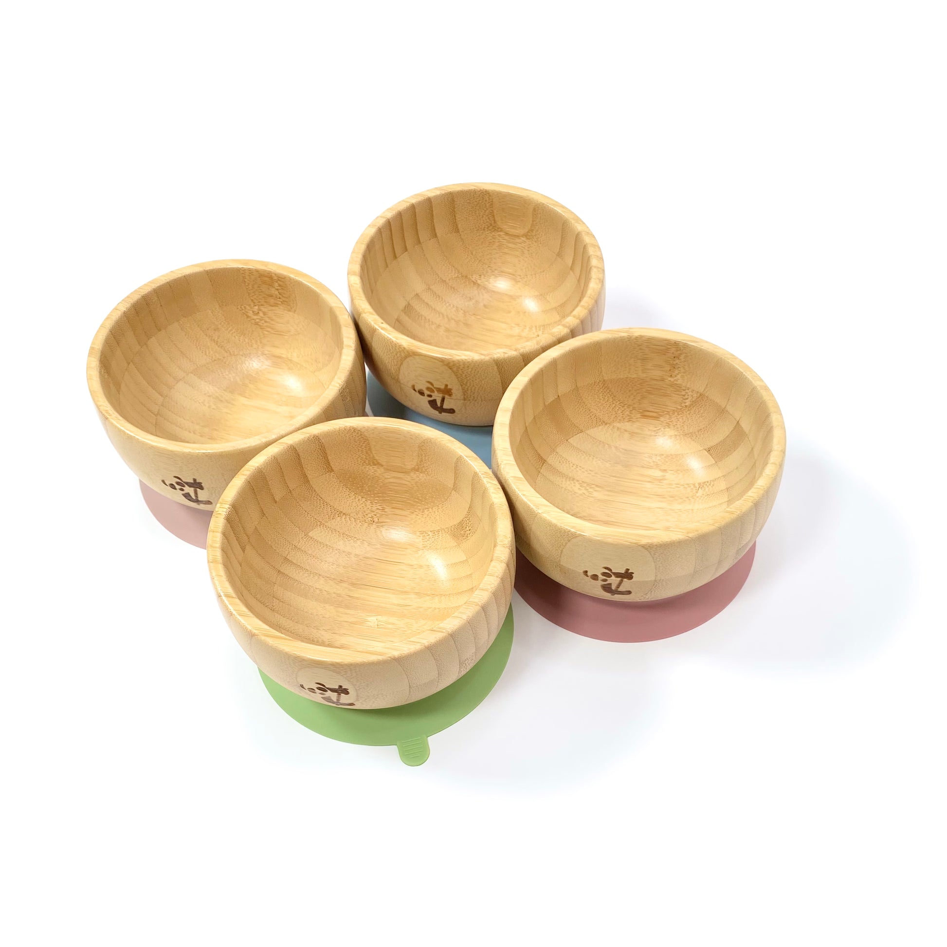 Four children’s bamboo bowls with silicone suction rings, available in four different ring colours: blossom pink, olive green, blush pink and sky blue. 