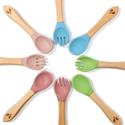 A range of children’s bamboo and silicone cutlery, available in blossom pink, blush pink, olive green and sky blue.