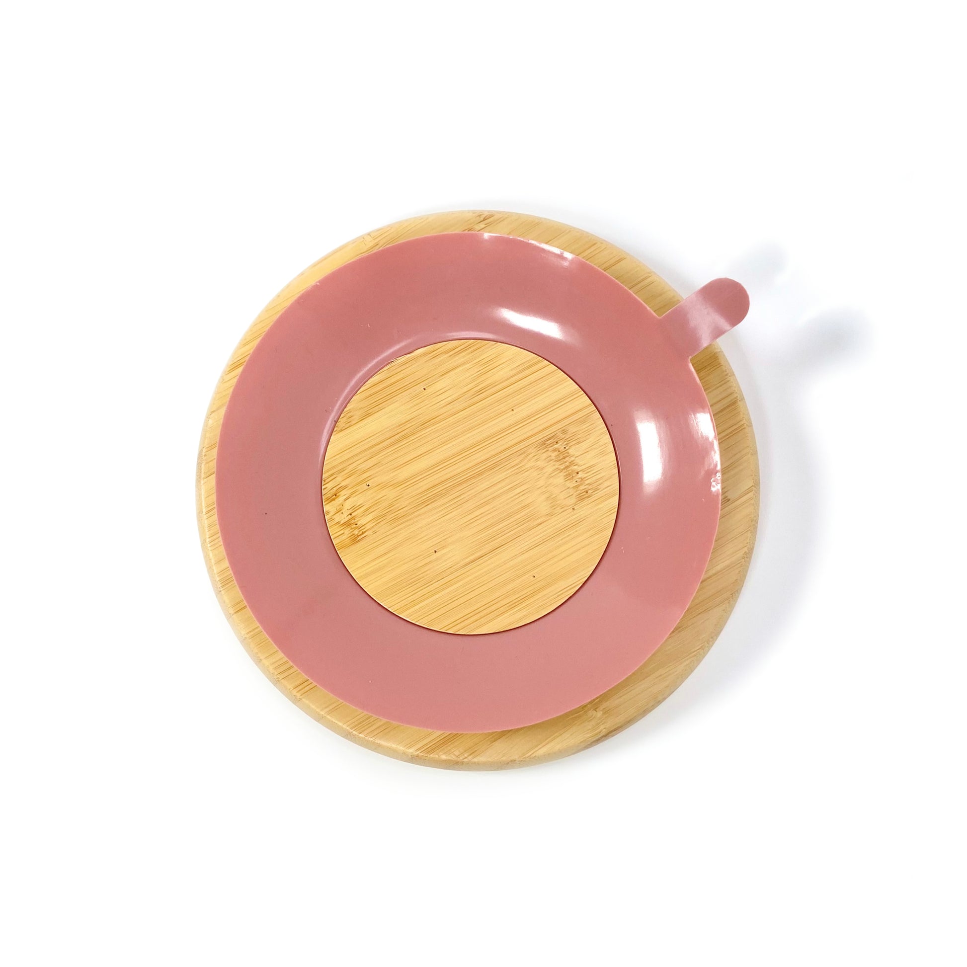 A children’s bamboo section plate with blush pink silicone suction ring on the base. Back view, featuring the blush pink silicone suction ring.