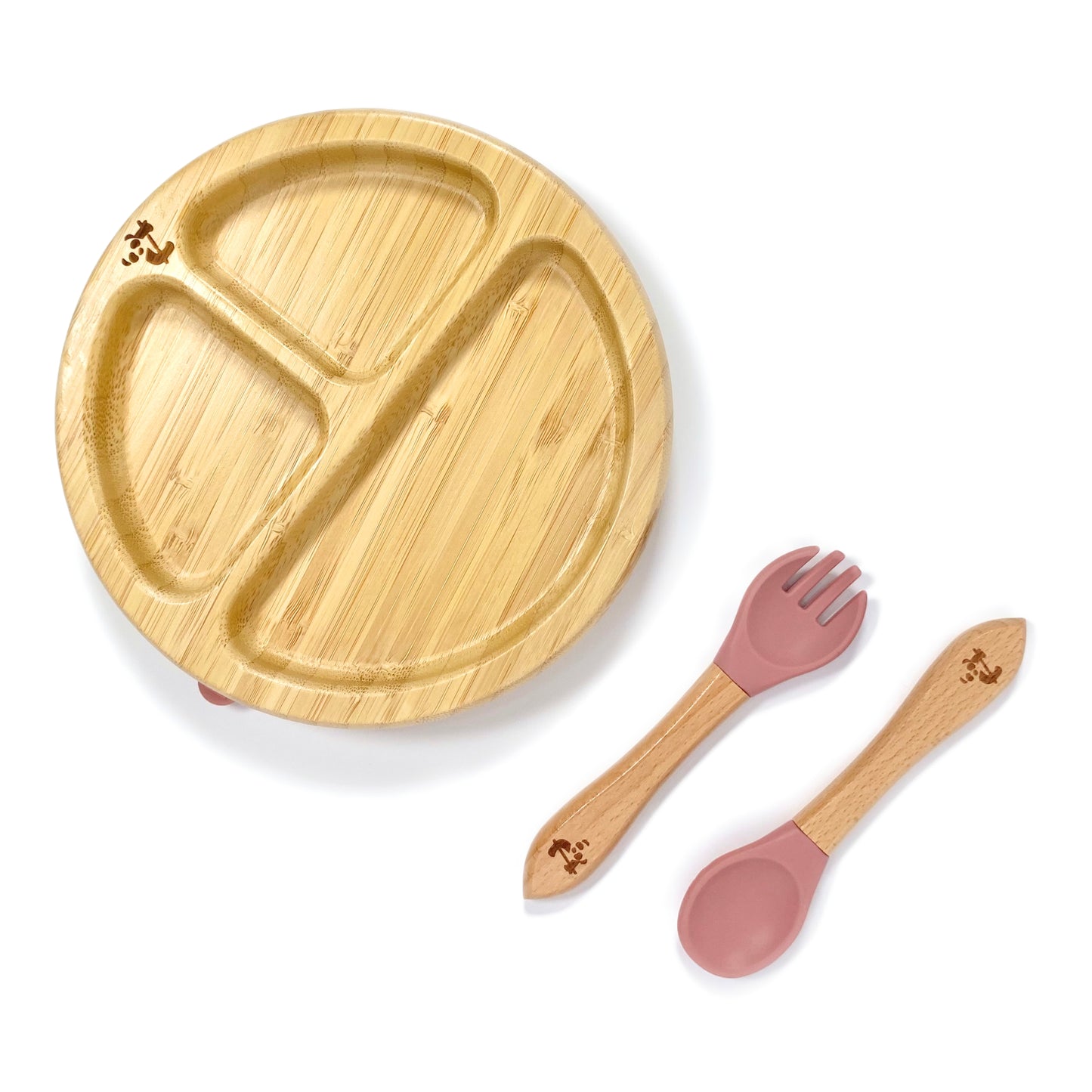 A children’s bamboo tableware set, including bamboo section plate with blush pink silicone suction ring, and matching bamboo and silicone cutlery.