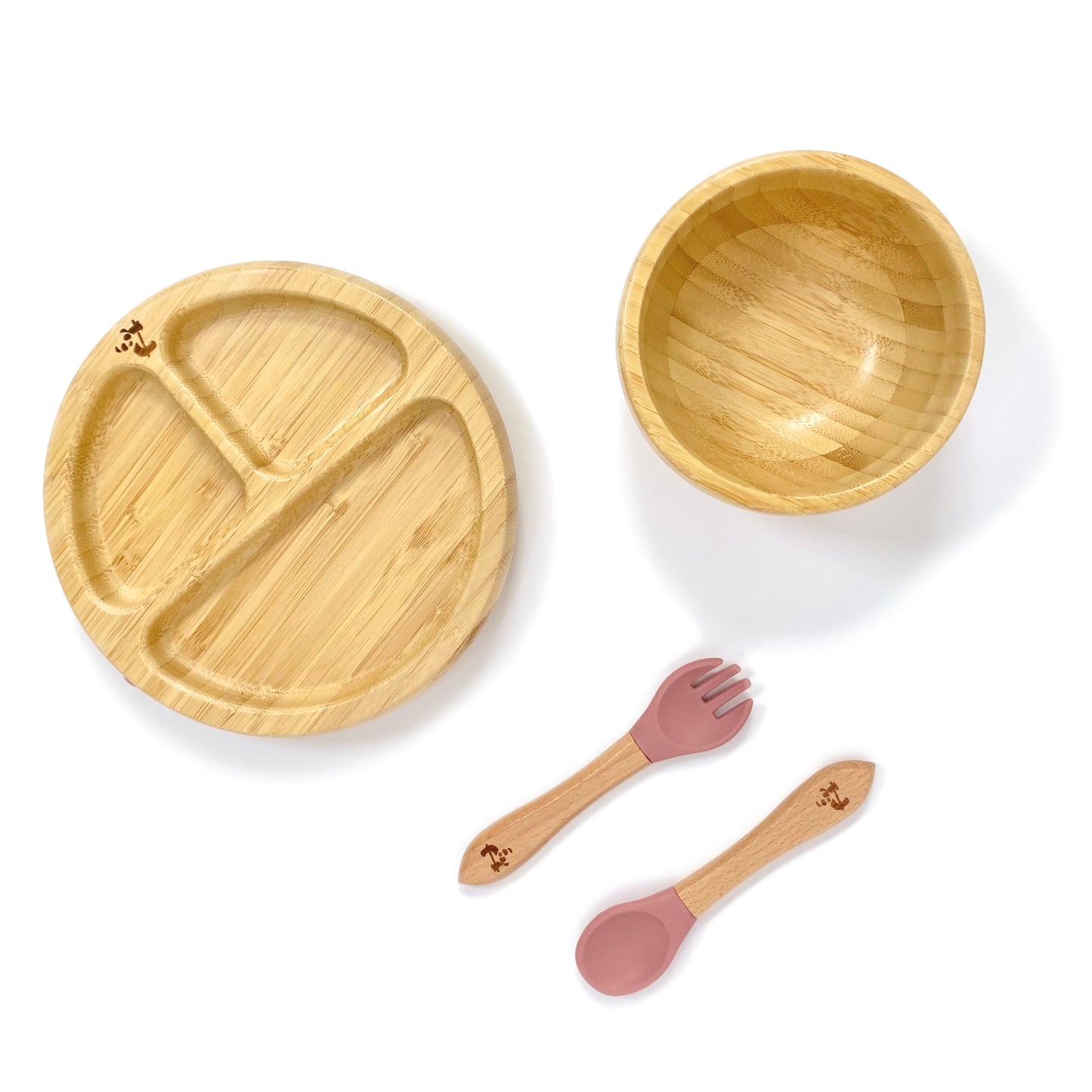 A children’s bamboo tableware set, including bamboo section plate with blush pink silicone suction ring, bamboo bowl with blush pink silicone suction ring and matching bamboo and silicone cutlery.