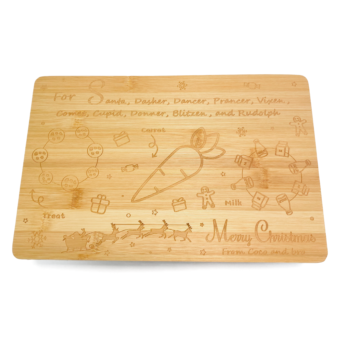 A festive bamboo board for children to leave treats for Santa/Father Christmas on Christmas Eve. A design is engraved into the board, featuring space for a treat, a glass of milk and a carrot for the reindeer. The message ‘Merry Christmas from Coco and bro’ is also engraved into the board.