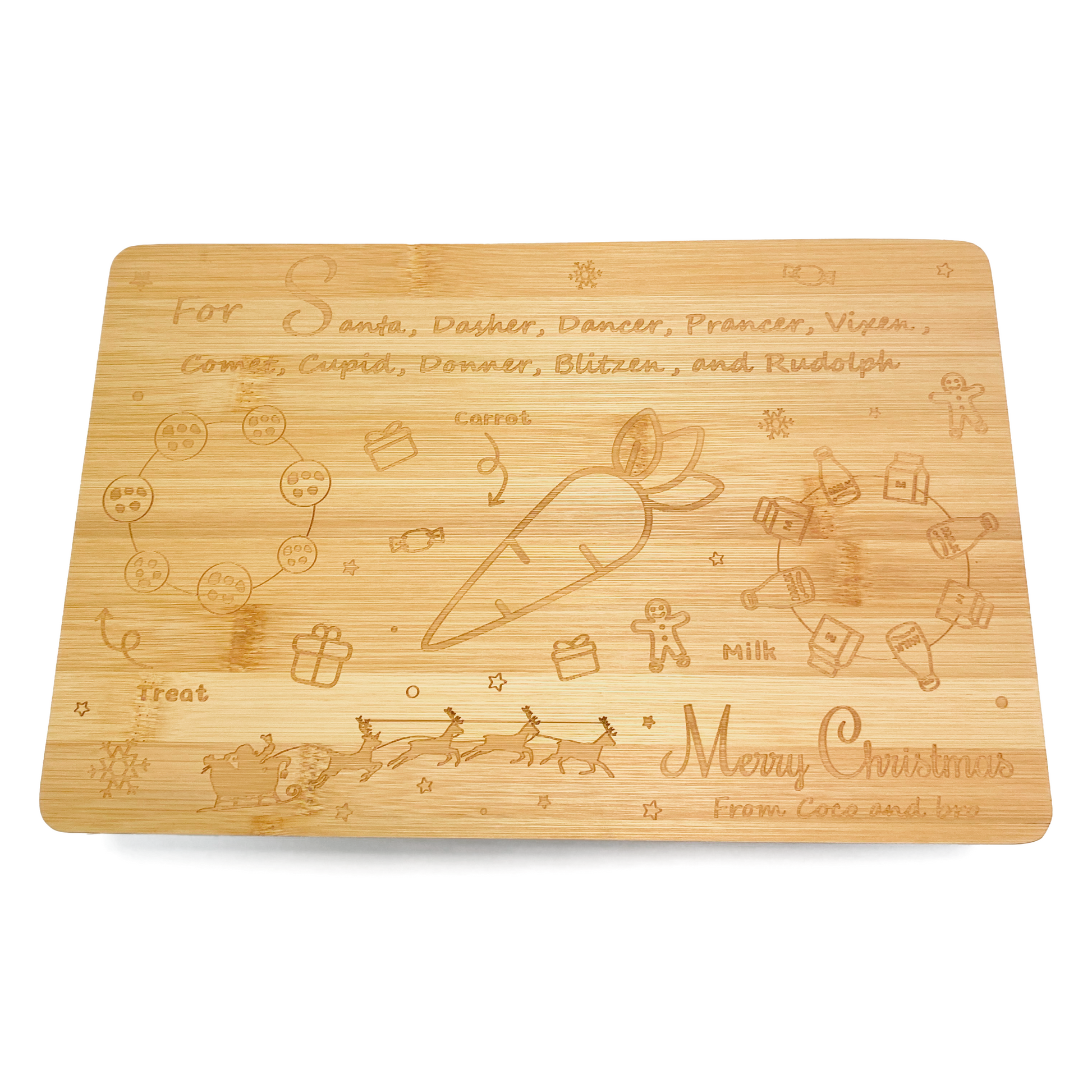 A festive bamboo board for children to leave treats for Santa/Father Christmas on Christmas Eve. A design is engraved into the board, featuring space for a treat, a glass of milk and a carrot for the reindeer. The message ‘Merry Christmas from Coco and bro’ is also engraved into the board.