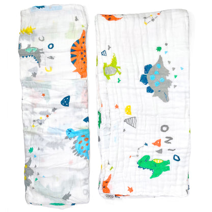 A set of two muslin baby blankets, one light swaddle blanket and one thick buggy blanket, with dinosaur crocodile designs.