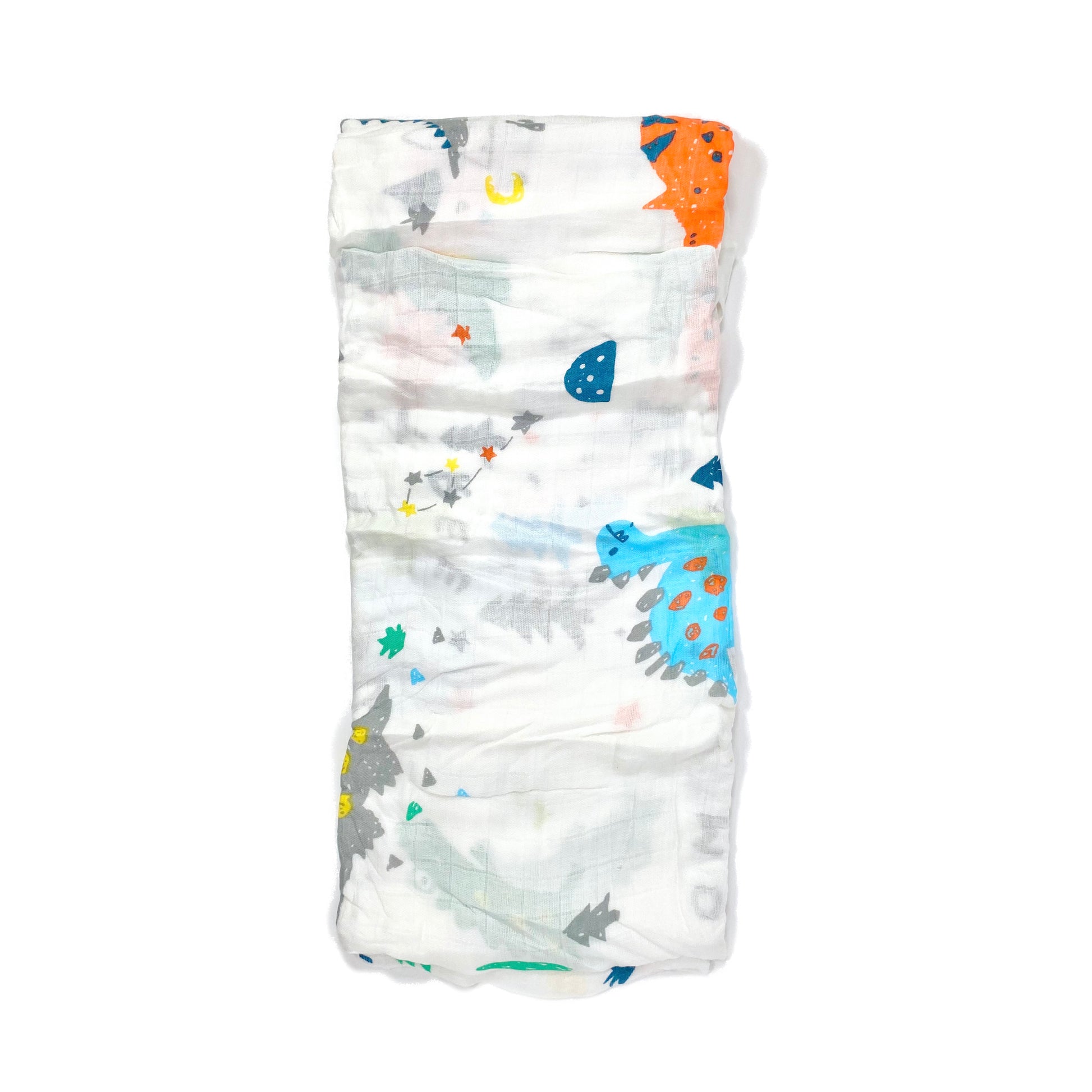 A folded muslin swaddle blanket with a dinosaur and crocodile design.
