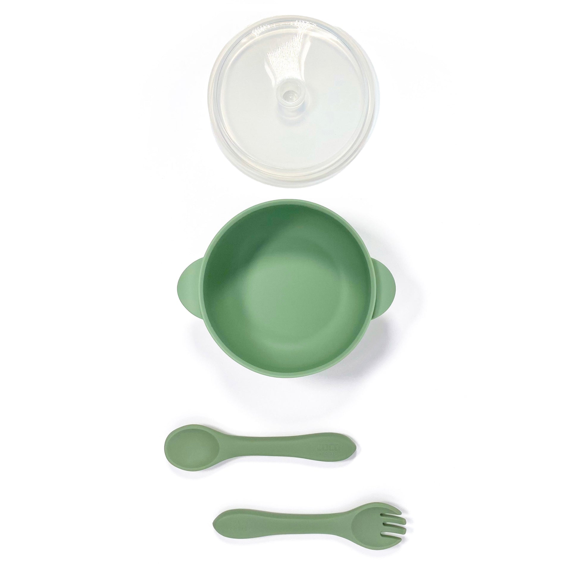 A forest green silicone children’s feeding set, including silicone bowl with lid and matching silicone cutlery. Image shows the bowl, lid and cutlery separately, from above. 