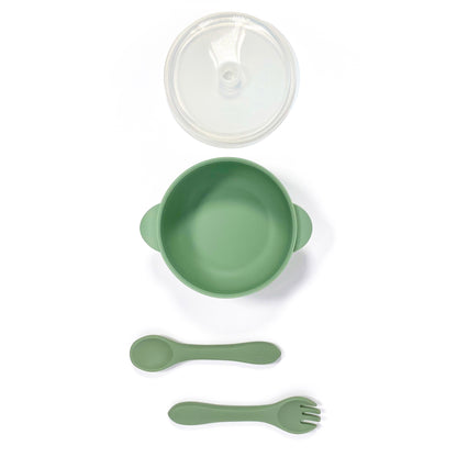 A forest green silicone children’s feeding set, including silicone bowl with lid and matching silicone cutlery. Image shows the bowl, lid and cutlery separately, from above. 