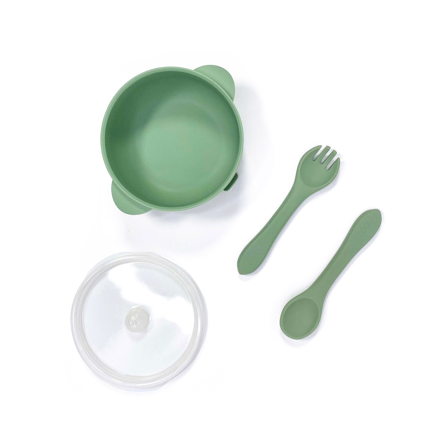 A forest green silicone children’s feeding set, including silicone bowl with lid and matching silicone cutlery. Image shows the bowl, lid and cutlery separately, from above. 