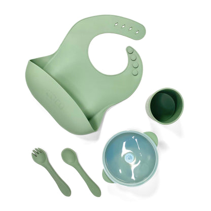 A forest green silicone children’s feeding set, including adjustable silicone bib with crumb catcher, silicone drinking cup, silicone bowl with lid and silicone cutlery.