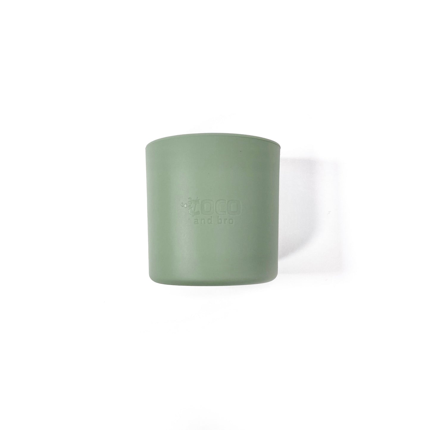 A forest green silicone children’s drinking cup. Side view.