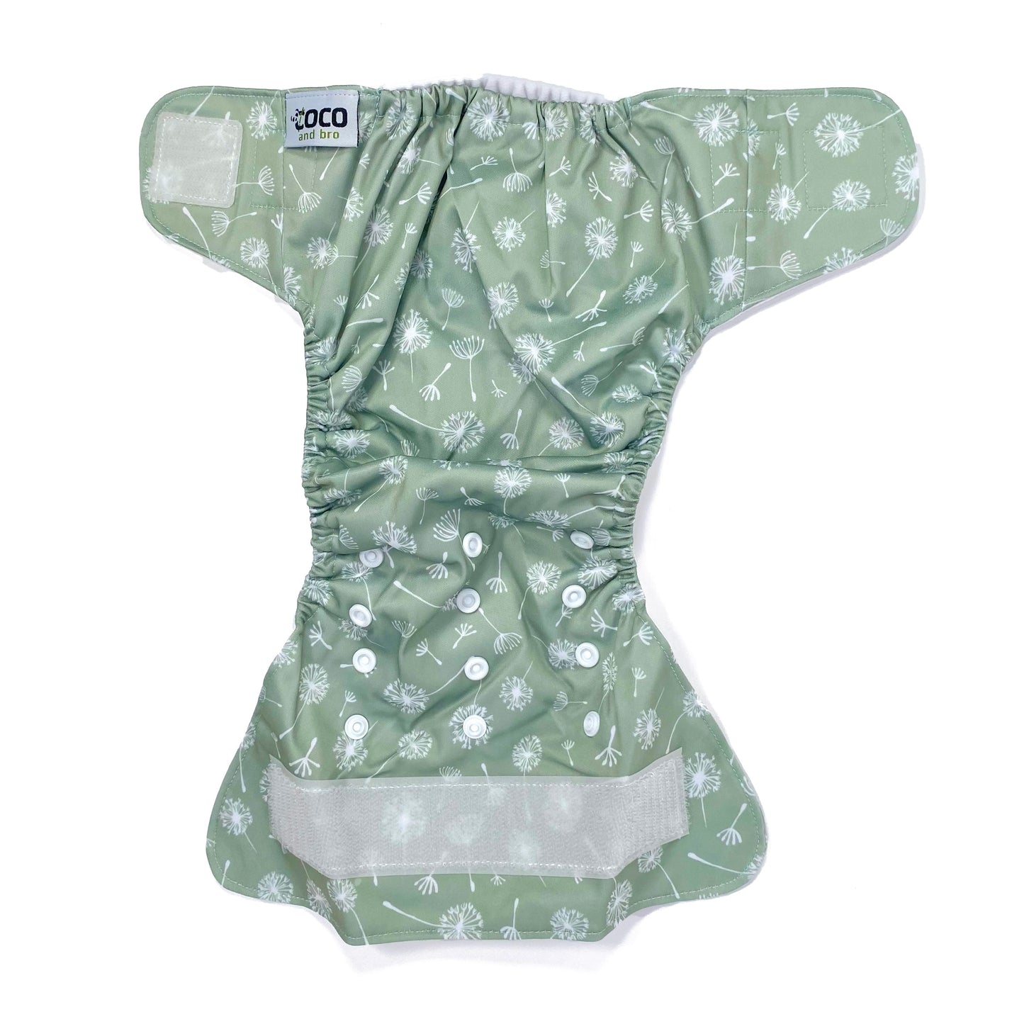 An adjustable reusable nappy for babies and toddlers, featuring a green dandelion design, with images of dandelion seeds on a green background. View shows the full outside pattern of the nappy, with fastenings open.