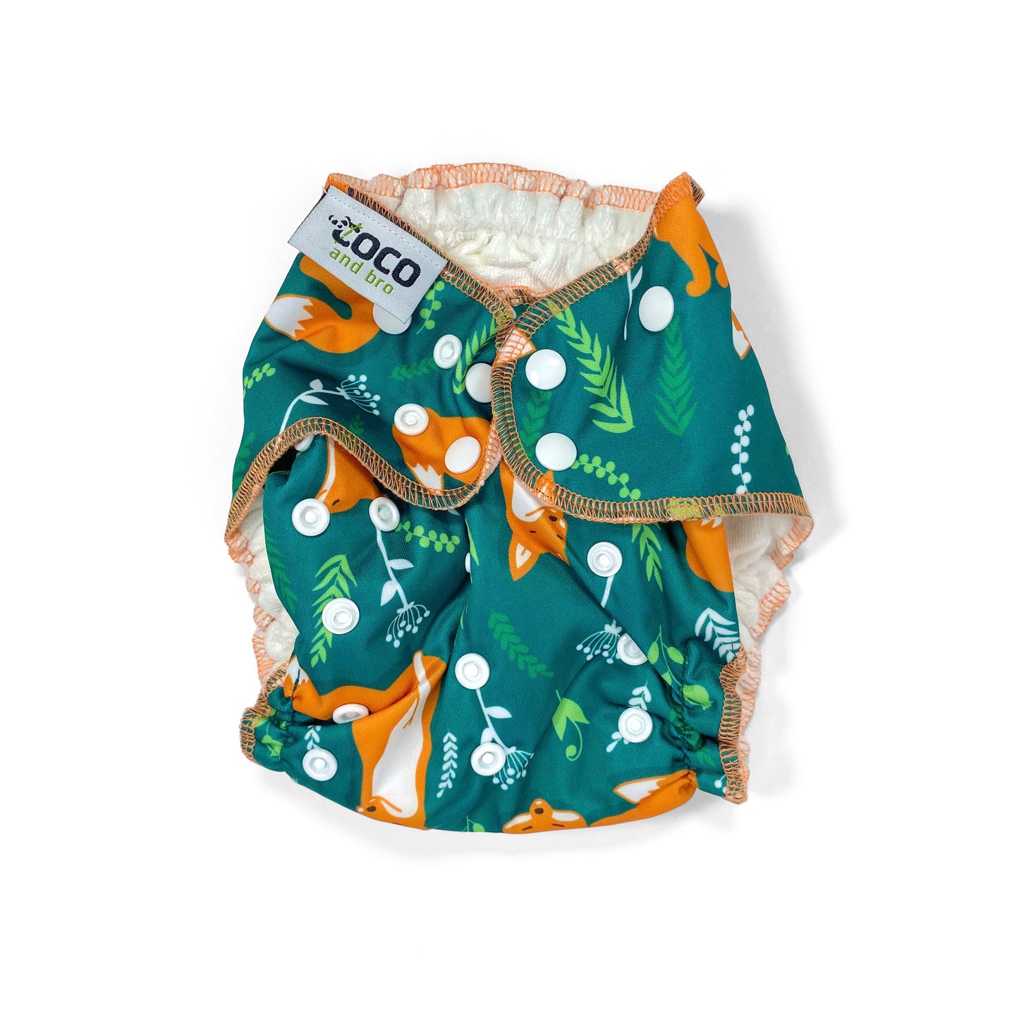 An adjustable reusable nappy for babies and toddlers, featuring a green fox design, with images of foxes on a green background. View shows the front of the nappy, with fastenings closed.
