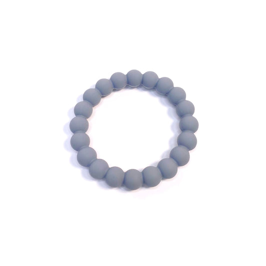 A blue beaded silicone teething ring. Can be worn as a bracelet.