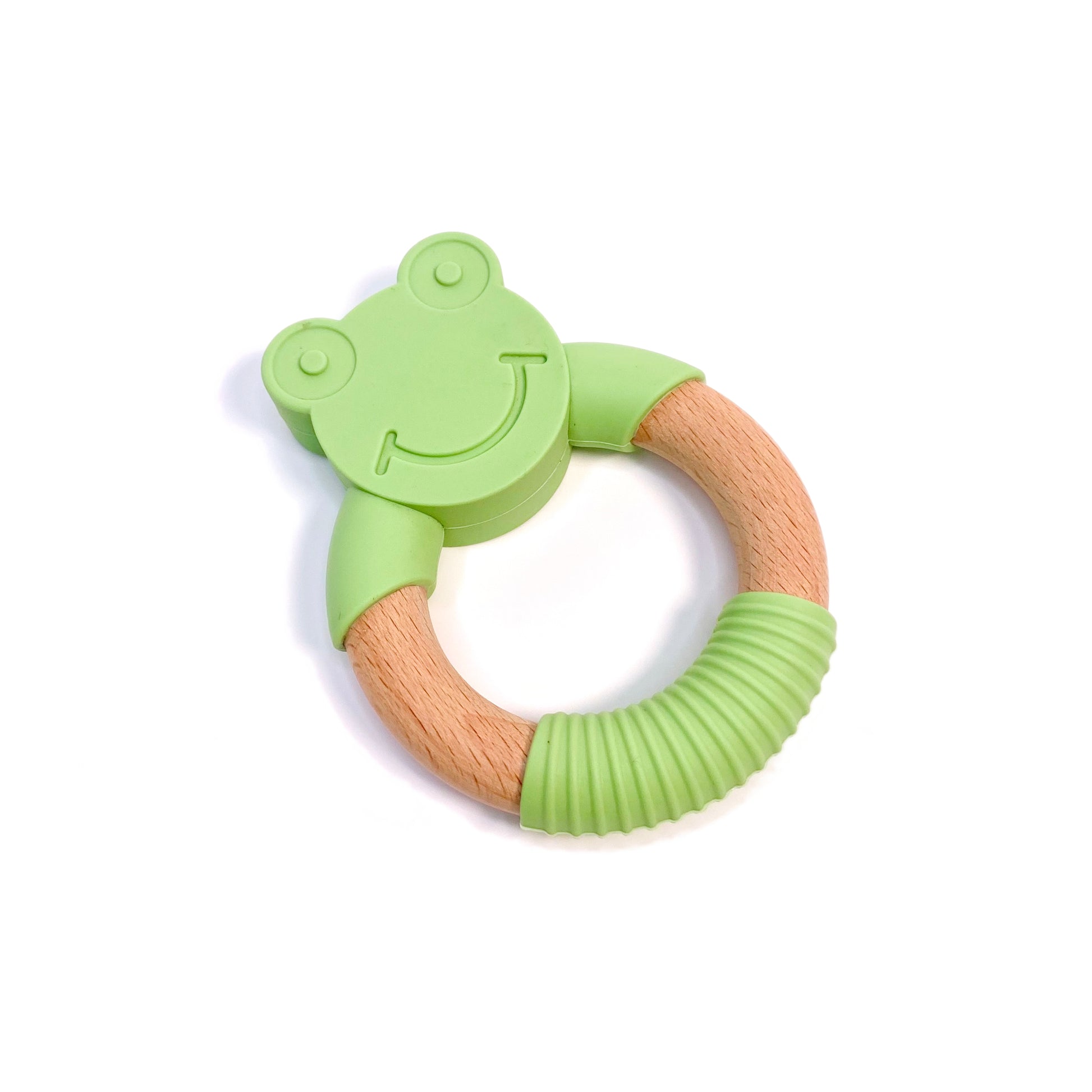 A teething ring made of silicone and bamboo, with a green frog design.