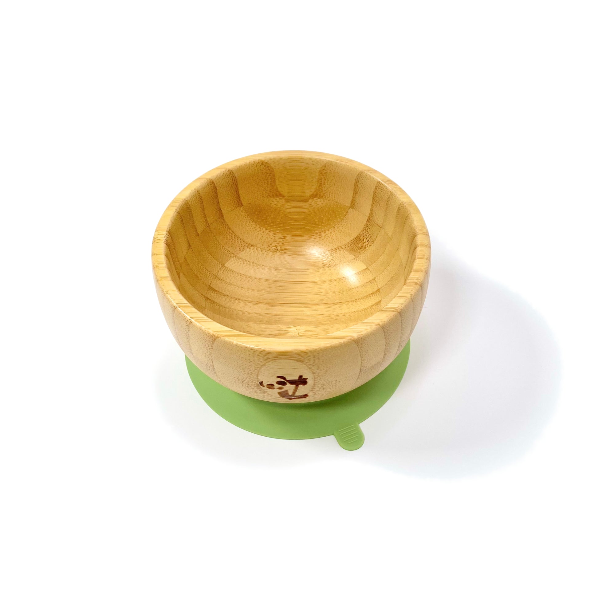 A children’s bamboo bowl with an olive green silicone suction ring.