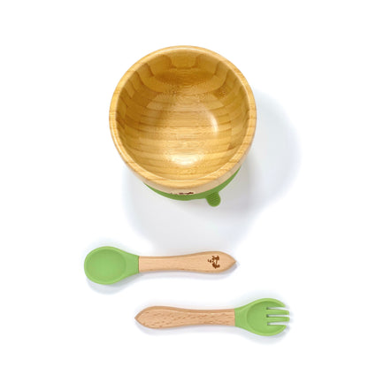 A children’s bamboo bowl with an olive green silicone suction ring, and matching olive green silicone and bamboo cutlery.