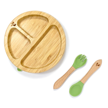A children’s bamboo tableware set, including bamboo section plate with olive green silicone suction ring, and matching bamboo and silicone cutlery.