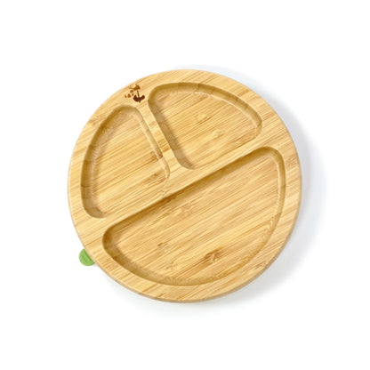 A children’s bamboo section plate with olive green silicone suction ring on the base.