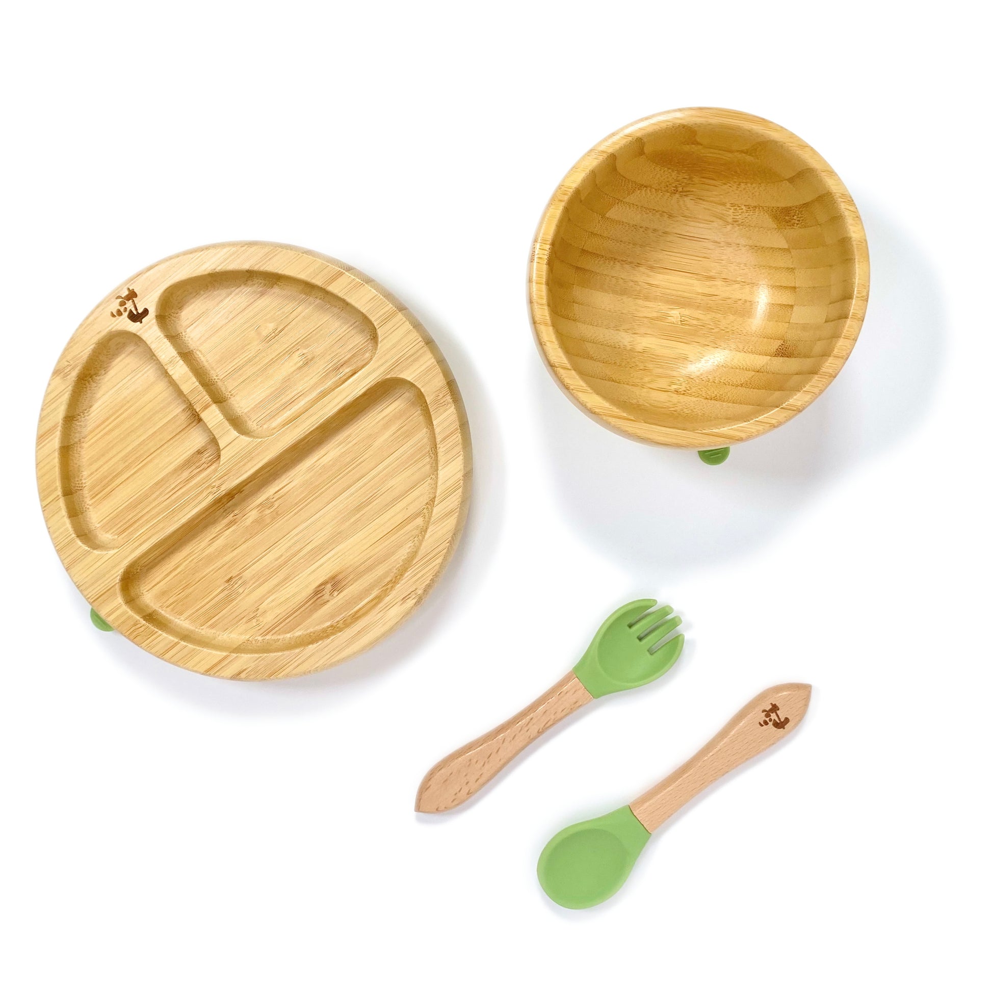 A children’s bamboo tableware set, including bamboo section plate with olive green silicone suction ring, bamboo bowl with olive green silicone suction ring and matching bamboo and silicone cutlery.