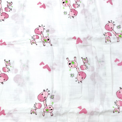 Close up pattern of a muslin swaddle blanket with a pink giraffe design.