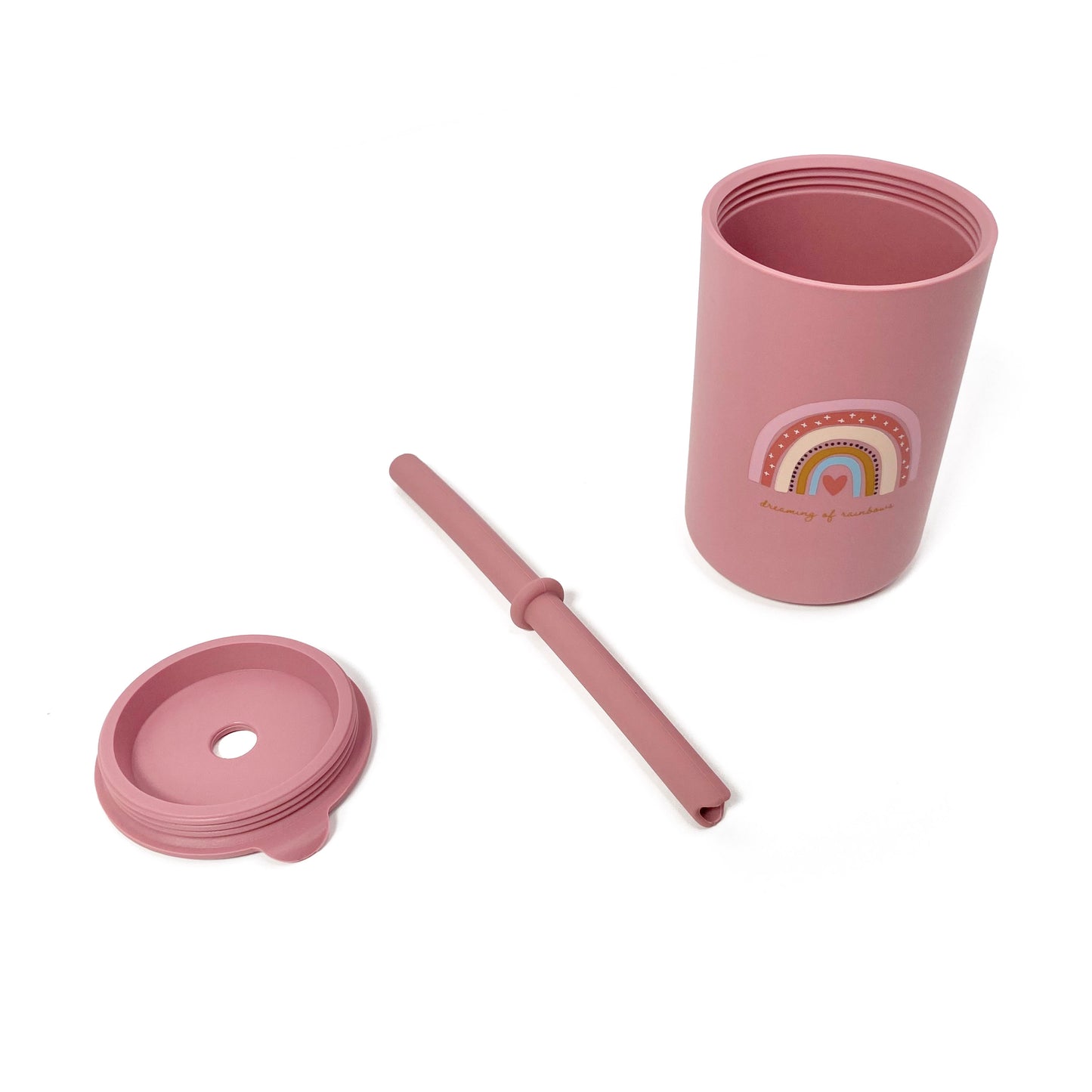 A children’s pink silicone drinking cup, with matching lid and straw, featuring a rainbow design. The image shows the cup, lid and straw separately.