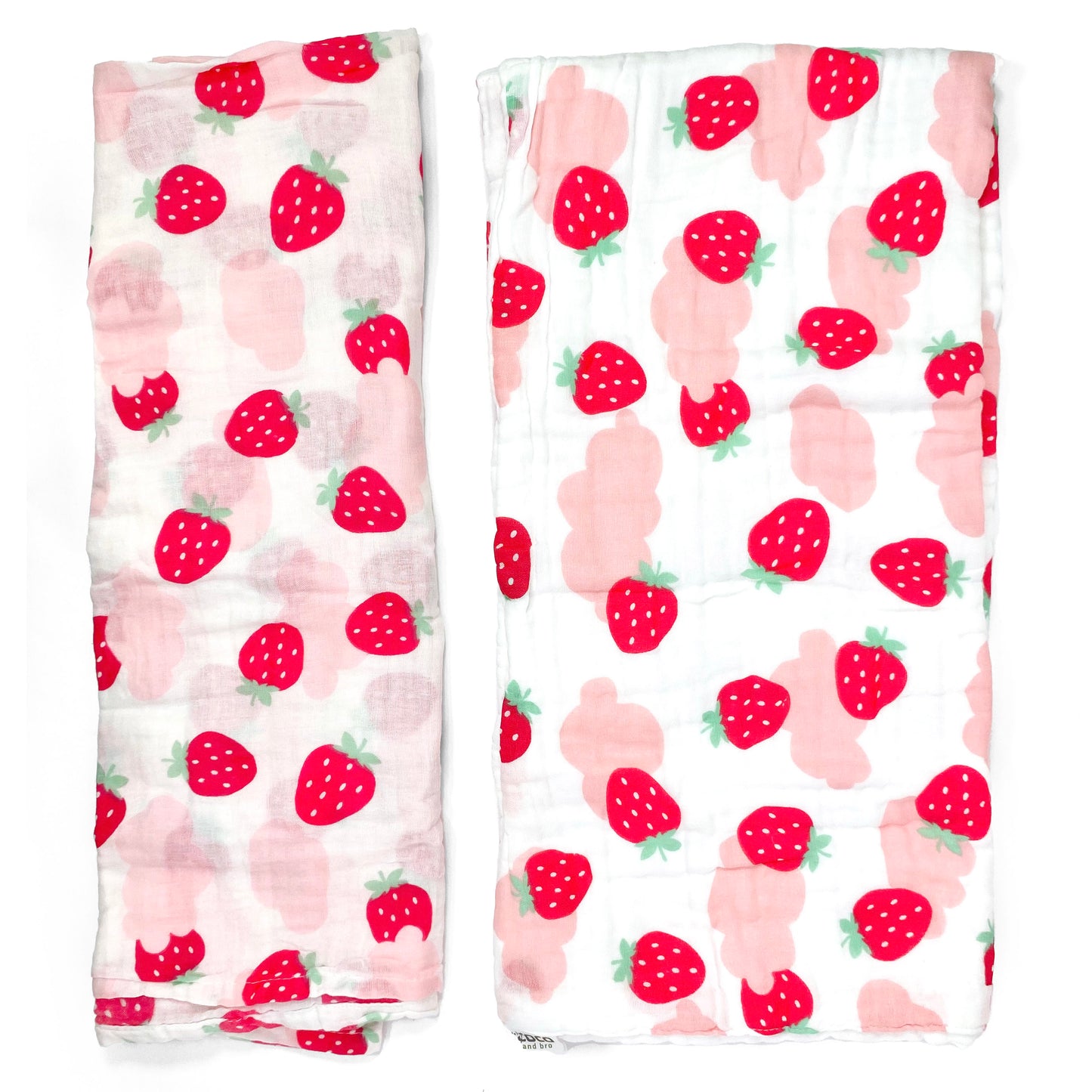 A set of two muslin baby blankets, one light swaddle blanket and one thick buggy blanket, with pink strawberry designs.