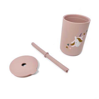 A children’s pink silicone drinking cup, with matching lid and straw, featuring a unicorn design. The image shows the cup, lid and straw separately.