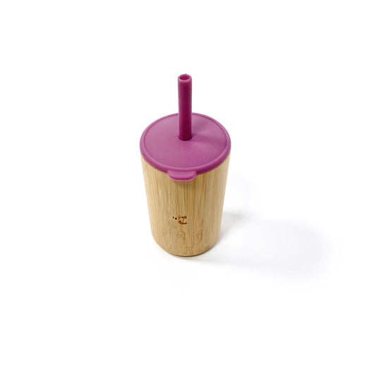 A children’s bamboo drinking cup, with a plum purple silicone lid and matching straw. View shows the cup with lid and straw attached.