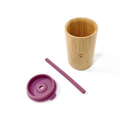 A children’s bamboo drinking cup, with a plum purple silicone lid and matching straw. View shows the cup, lid and straw separately.