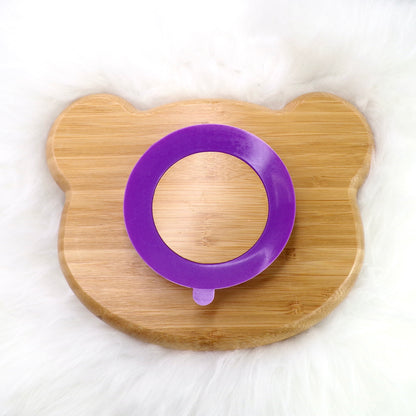 A children's bamboo section plate with a panda design, purple colour silicone suction ring and matching purple bamboo and silicone cutlery. Back view.