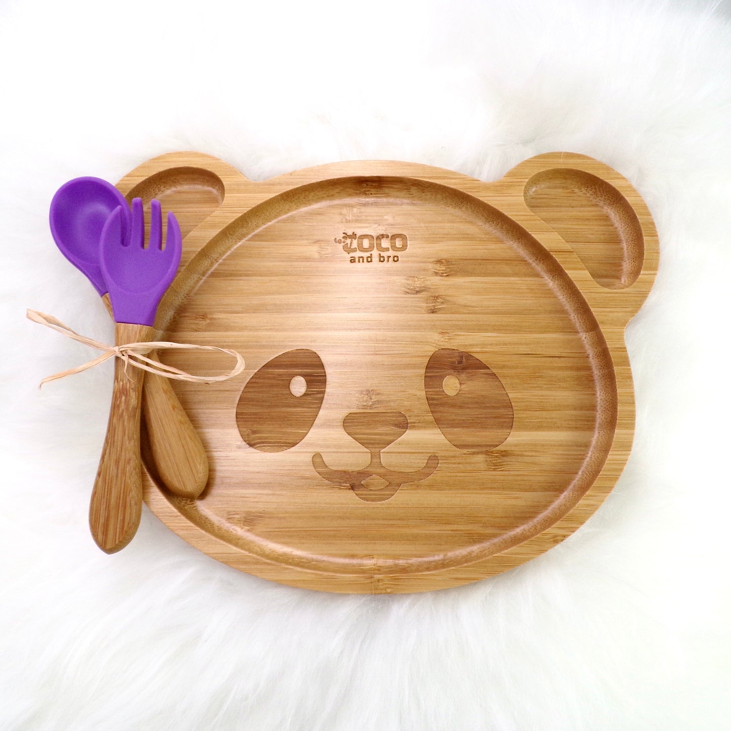 A children's bamboo section plate with a panda design, purple colour silicone suction ring and matching purple bamboo and silicone cutlery. Front view.