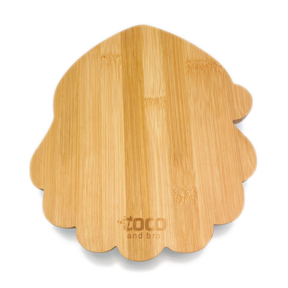 A festive children's bamboo plate in the shape of Santa/Father Christmas. The face of Santa/Father Christmas is engraved onto the plate with the message 'Merry Christmas’. Image shows the back of the plate.