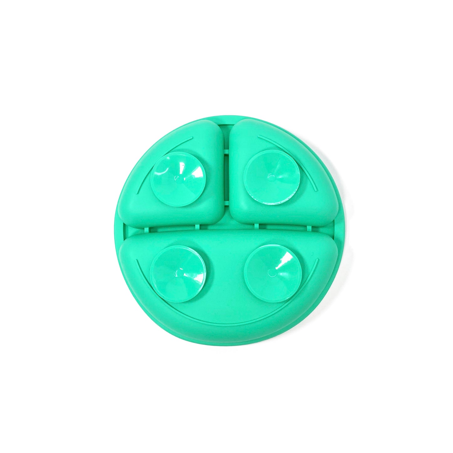 A seafoam green silicone children’s section plate with suction cups on the base. View shows the underside of the plate.