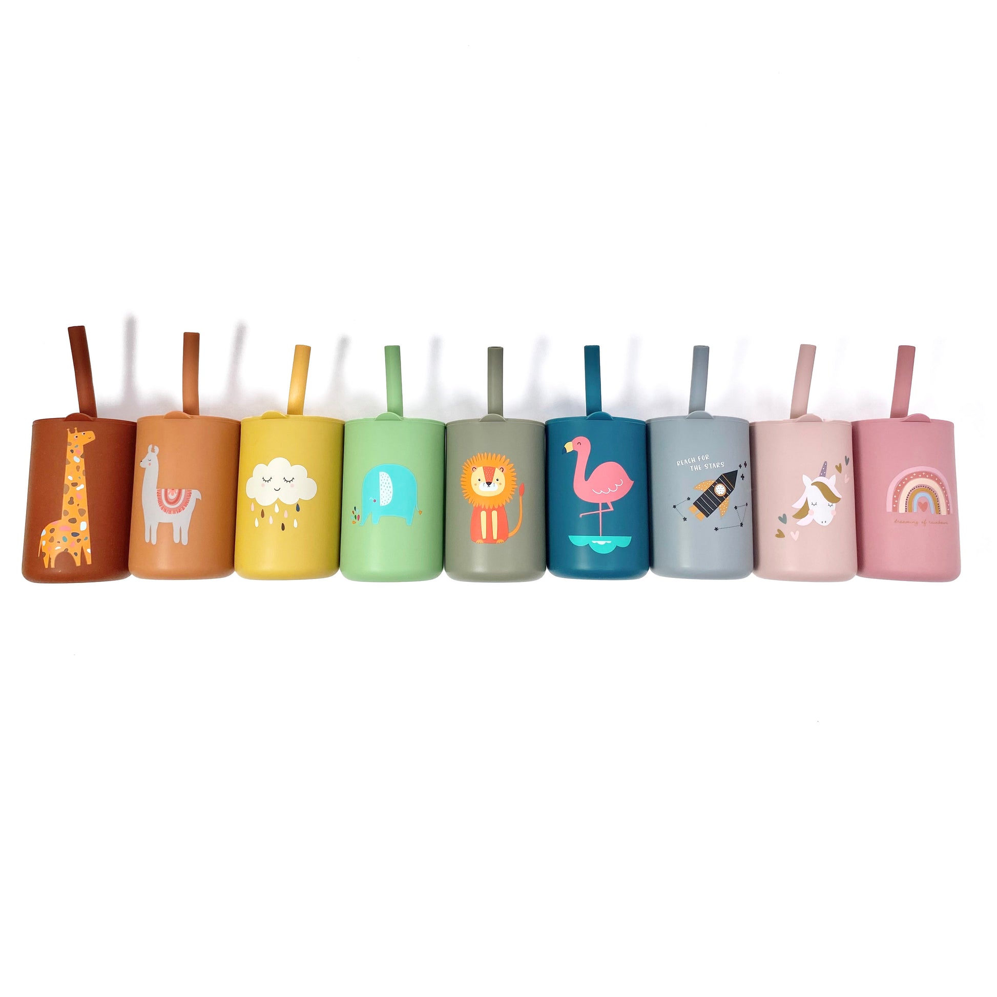 A collection of children’s silicone drinking cups with matching lids and straws, in various colours and designs, laid out in a line.