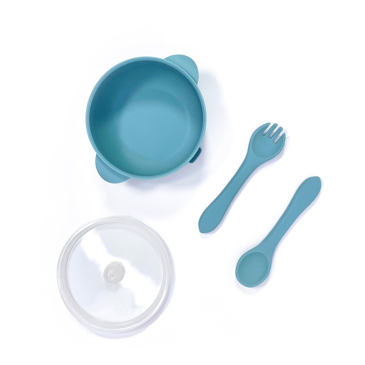 A sky blue silicone children’s feeding set, including silicone bowl with lid and matching silicone cutlery. Image shows the bowl, lid and cutlery separately, from above.
