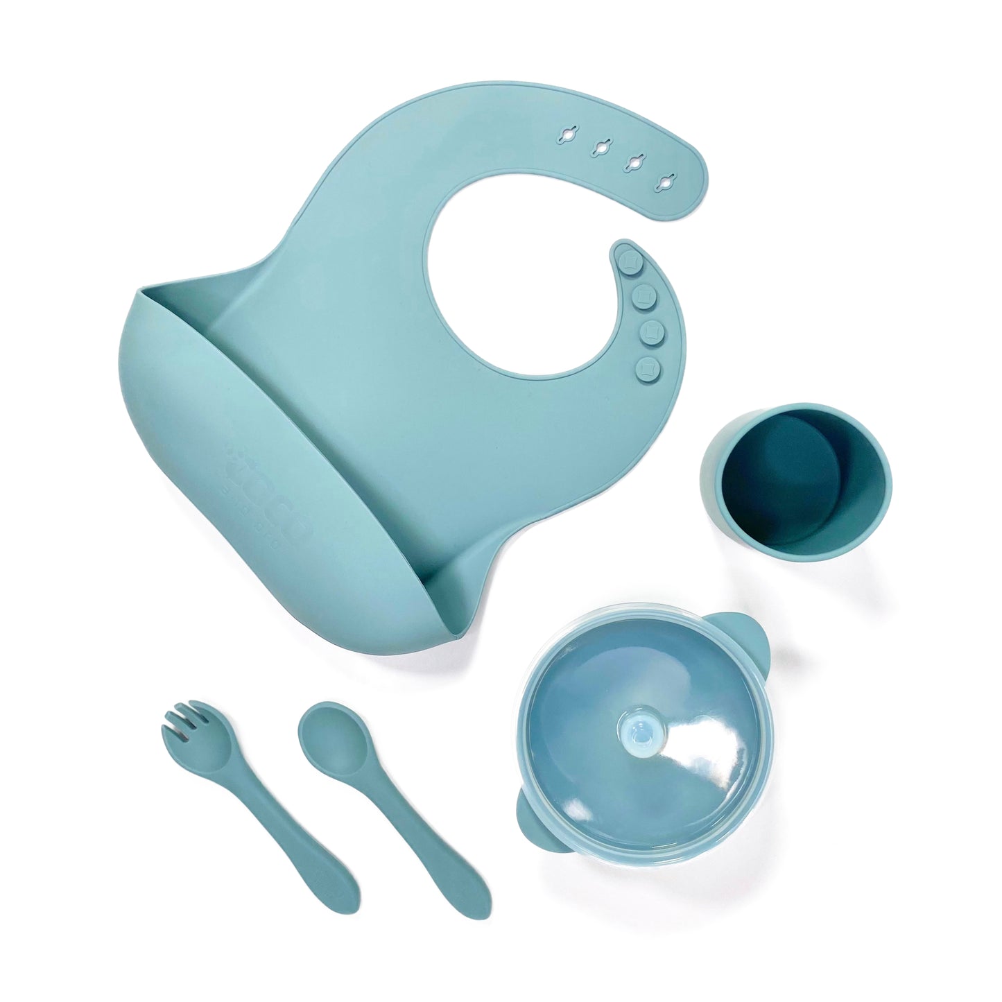 A sky blue silicone children’s feeding set, including adjustable silicone bib with crumb catcher, silicone drinking cup, silicone bowl with lid and silicone cutlery.