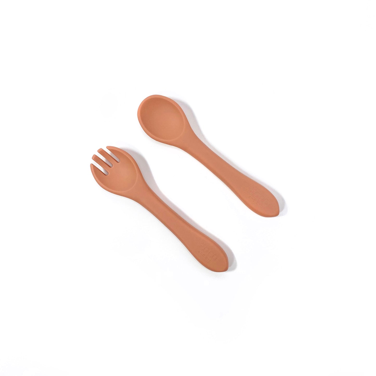 A set of sunset orange silicone children’s cutlery.