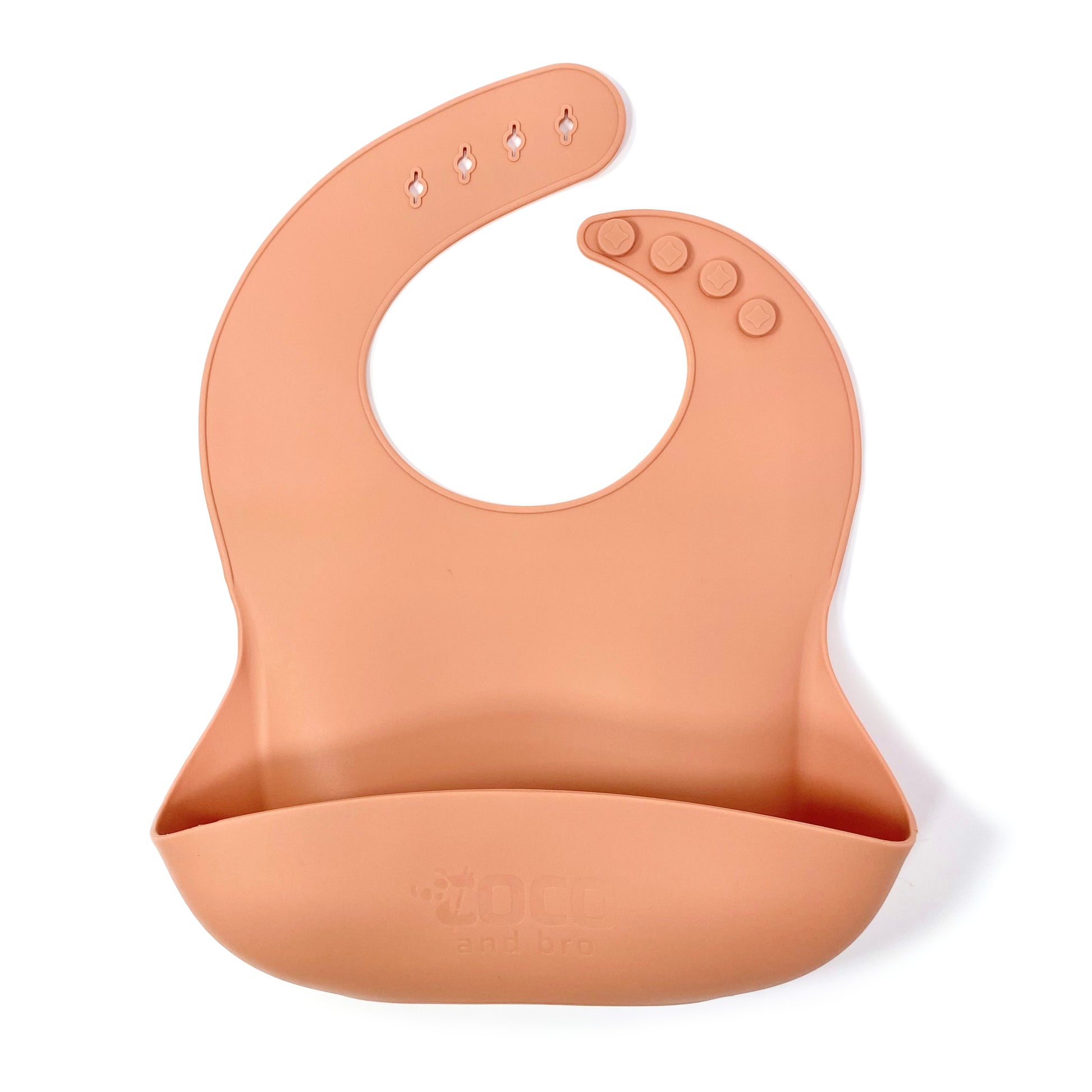 An adjustable sunset orange silicone children’s bib with crumb catcher pocket.