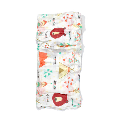 A folded muslin swaddle blanket with a teepee design.