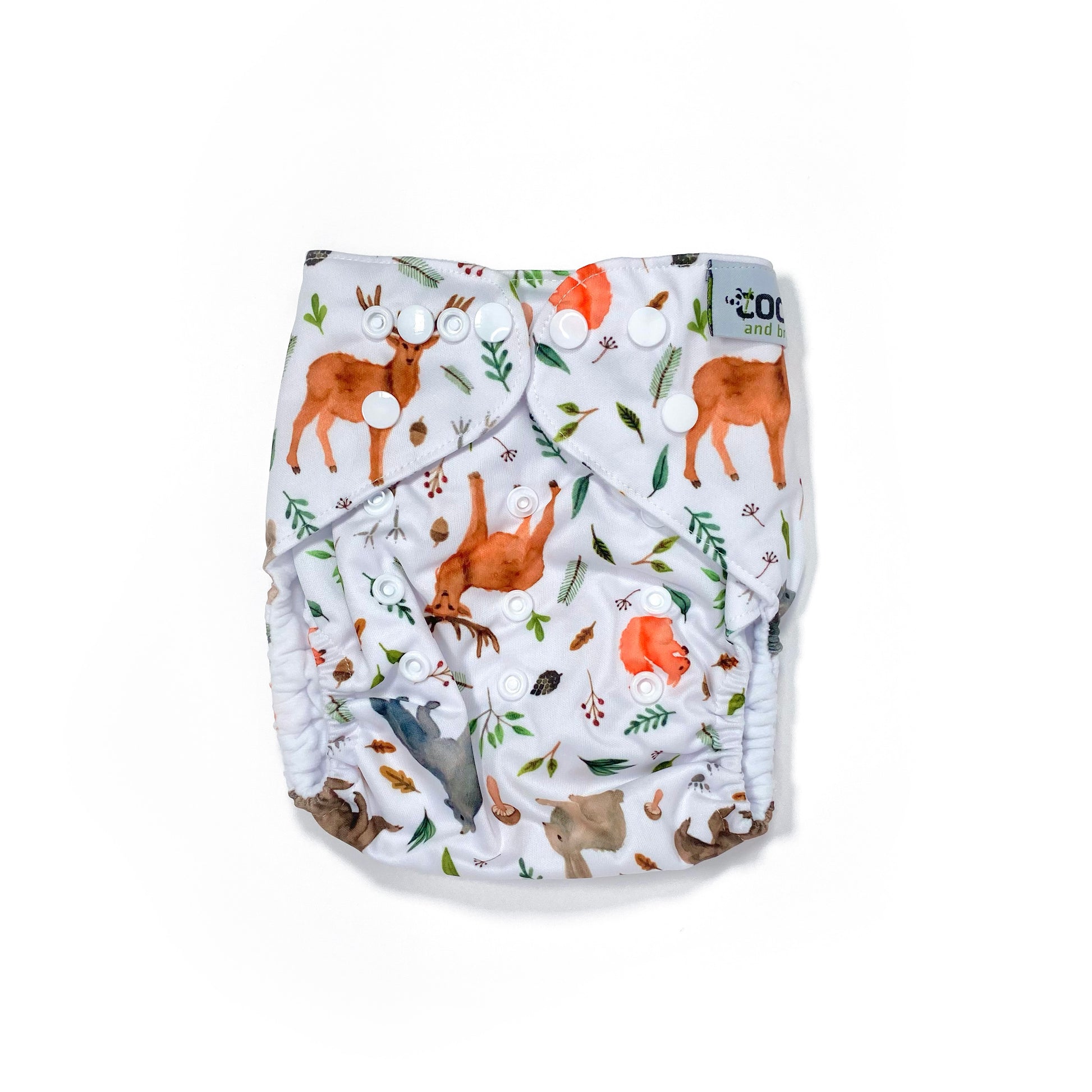 An adjustable reusable nappy for babies and toddlers, featuring a woodland animal design, with images of various woodland animals on a white background. View shows the front of the nappy. 