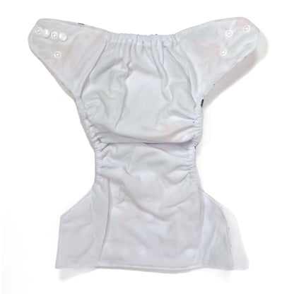 An adjustable reusable nappy for babies and toddlers, featuring a woodland animal design, with images of various woodland animals on a white background. View shows the inside fabric of the nappy.