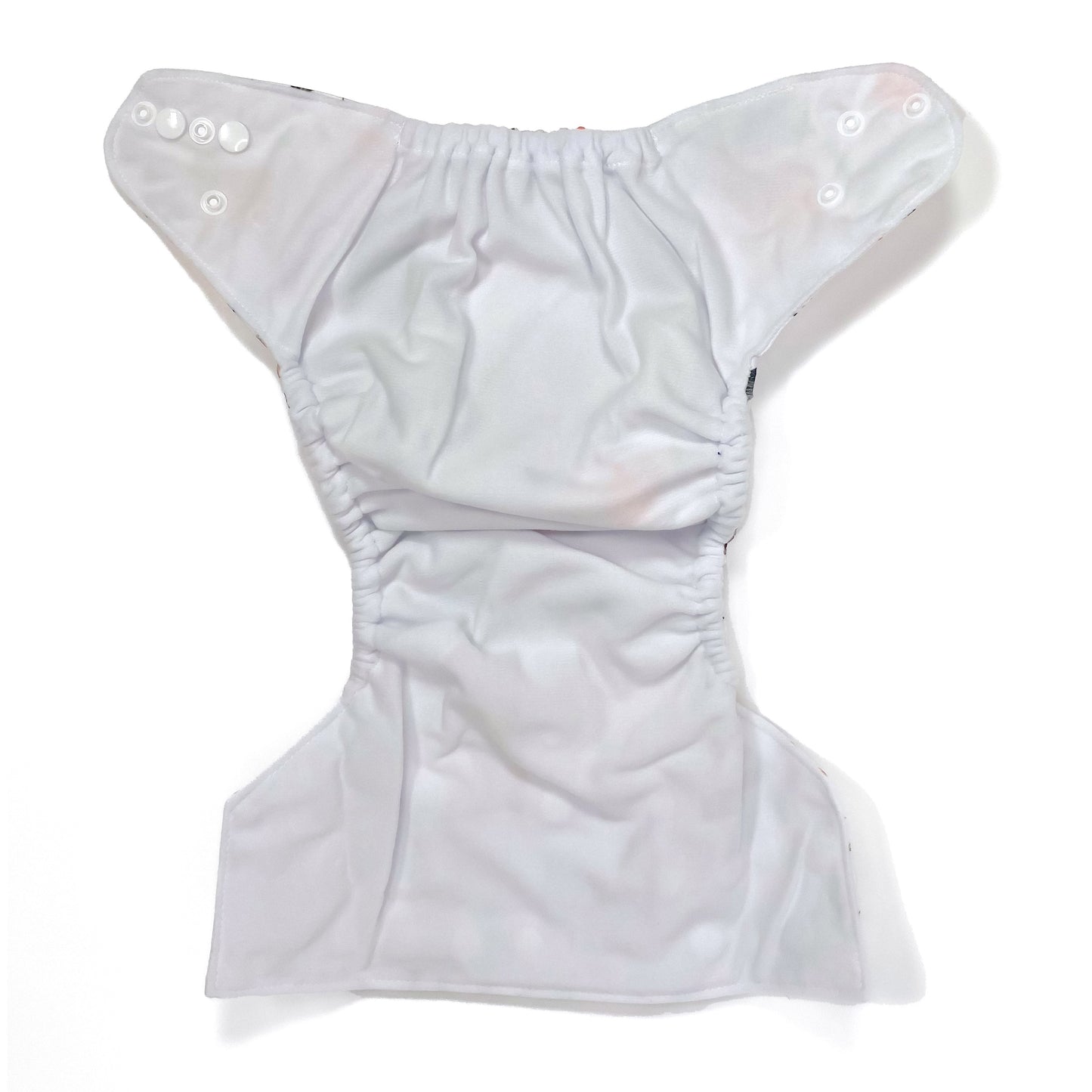 An adjustable reusable nappy for babies and toddlers, featuring a woodland animal design, with images of various woodland animals on a white background. View shows the inside fabric of the nappy.
