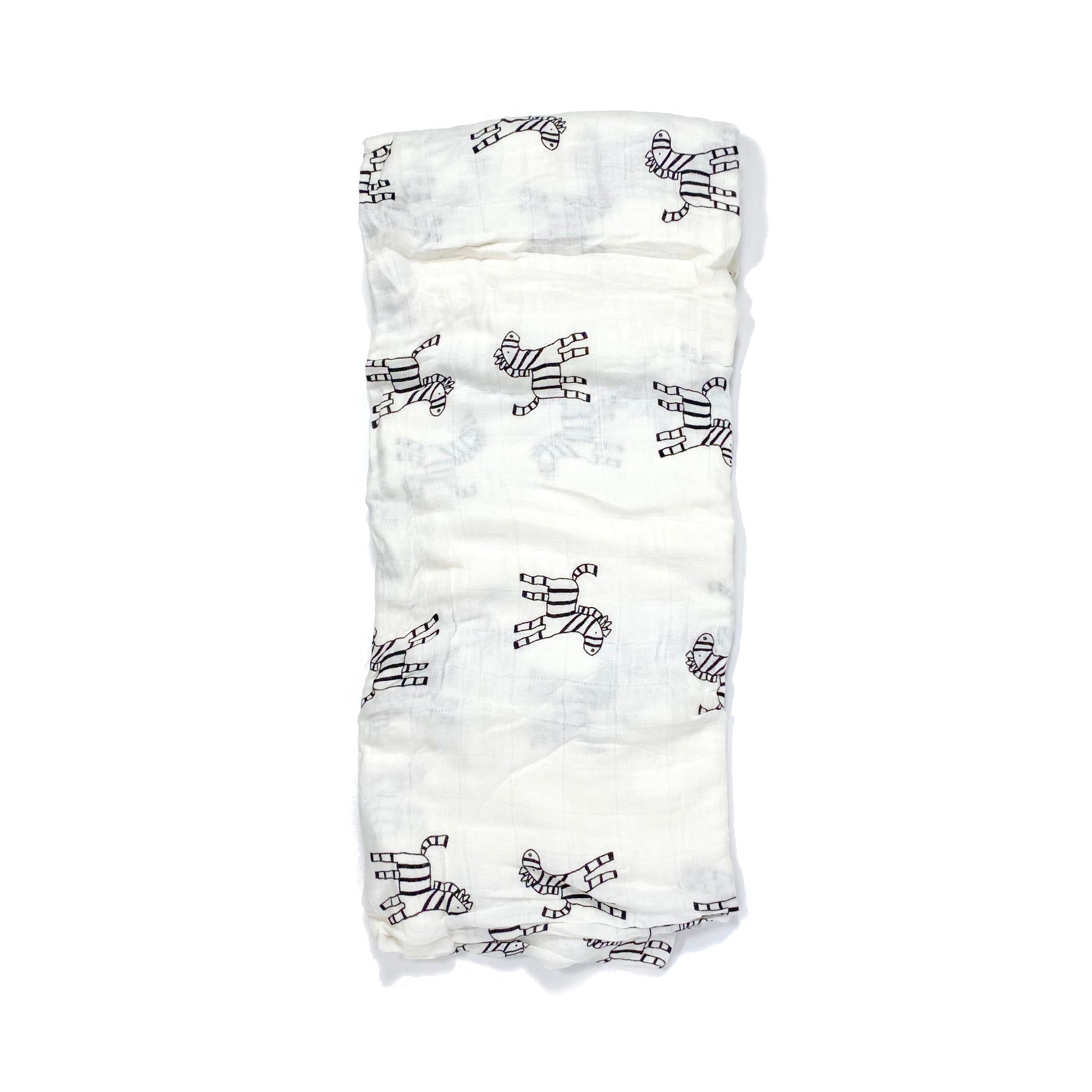 A folded muslin swaddle blanket with a zebra design.