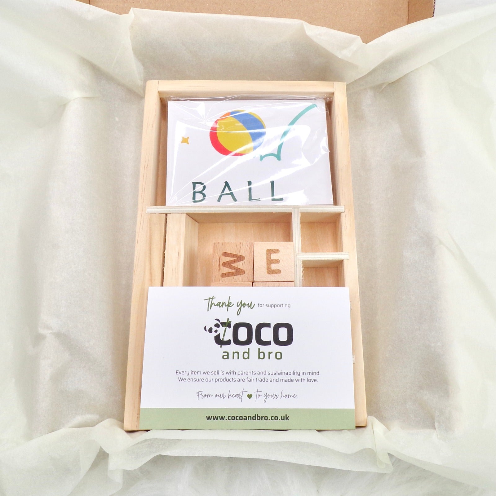 A children's wooden alphabet blocks spelling toy, with wooden letter blocks and spelling cards.