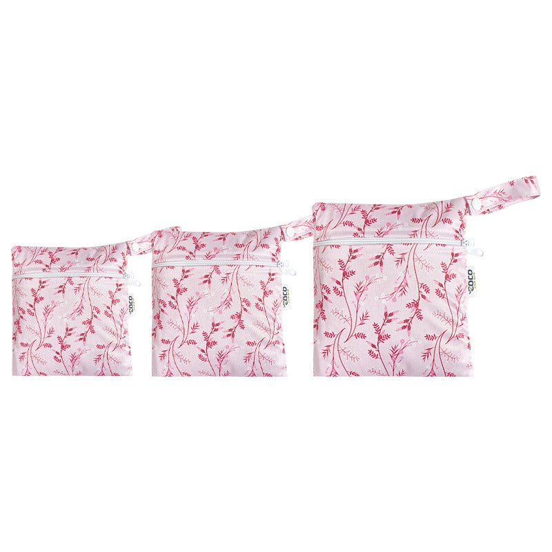 A set of three waterproof bags in a pink floral design, made from bamboo and in three different sizes. Each bag has a zipper closure.
