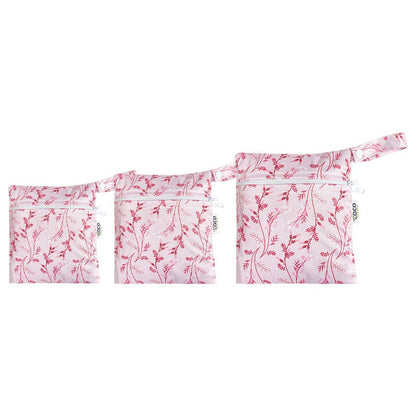 A set of three waterproof bags in a pink floral design, made from bamboo and in three different sizes. Each bag has a zipper closure.