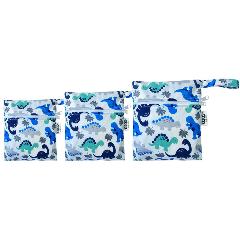 A set of three waterproof bags in a blue dinosaur design, made from bamboo and in three different sizes. Each bag has a zipper closure.